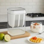 Click to see full view Transparent rectangular yogurt strainer with white lid and inner mesh filter insert, shown on a